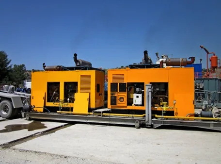 Yellow industrial generator sets in an outdoor installation