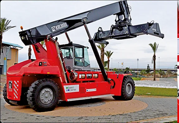 Red reach stacker handling a container at a port